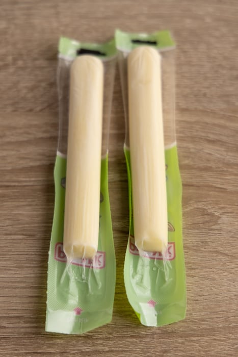 Two frozen cheese sticks